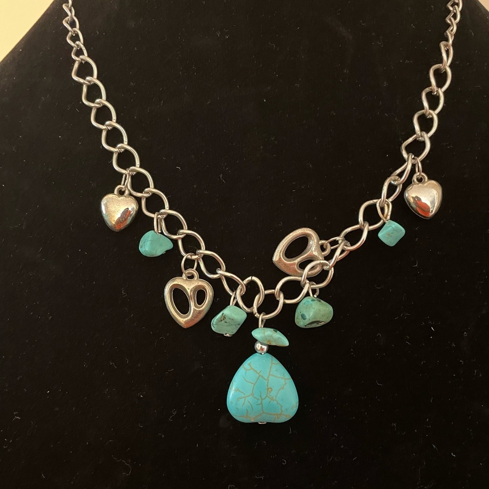 Silver charm necklace with turquoise stones and silver metal hearts